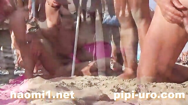 Public masturbation on the beach leads to group sex