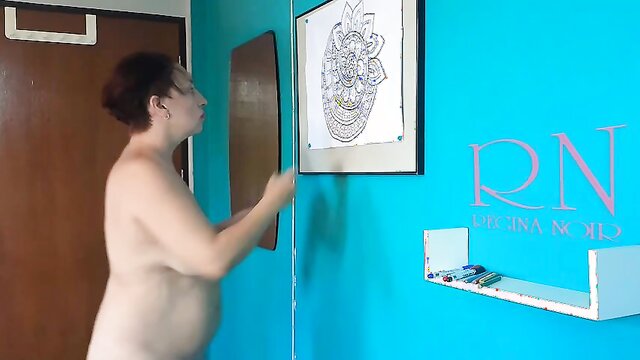 Desi nudist paints Indian mandala with relaxing music. Naked artwork.