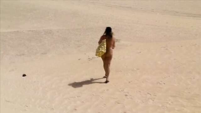 German blond MILF enjoys nudist holiday on a nude beach