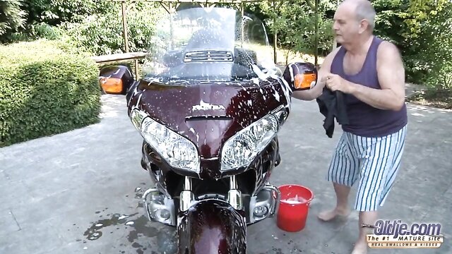 Watch Ntaly Von clean a bike and get fucked by an old man