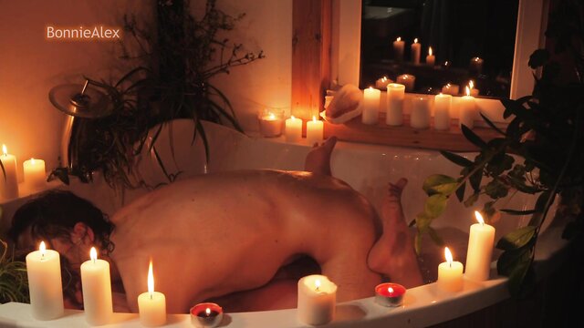 Amateur couple enjoys romantic sex in bath with candles