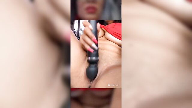 Latina mom in a car showcasing her beauty