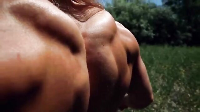 Female bodybuilder flexes in solo video