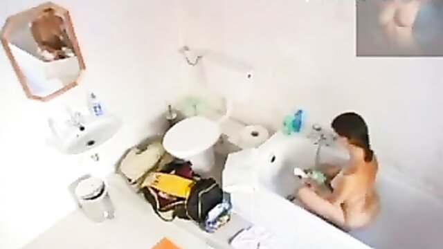 Beautiful girl in bathroom gets naughty with hidden camera